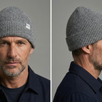 Lambswool Beanie in Grey worn by a model – front and side view