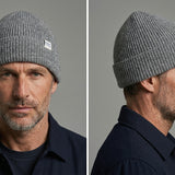 Lambswool Beanie in Grey worn by a model – front and side view