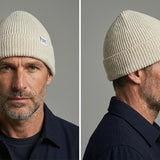 Lambswool Beanie in Off White worn by a model – front and side view