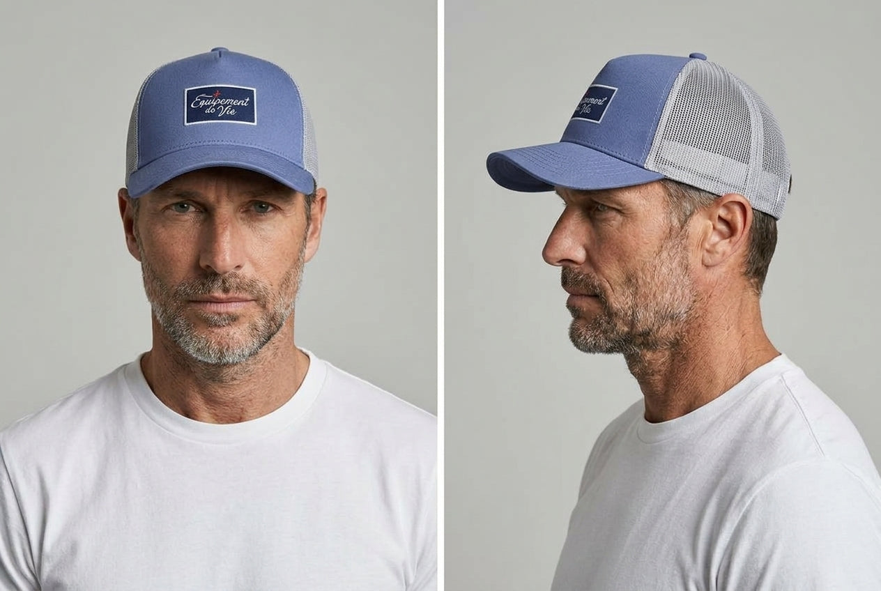 Trucker Cap in Dust Blue and Grey worn by a model – front and side view